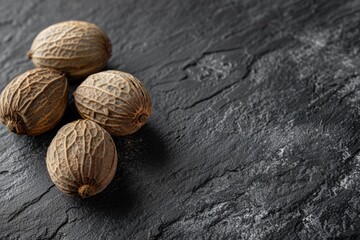 Poster - Group of nuts sitting on top of a wooden table, perfect for food and nutrition concepts