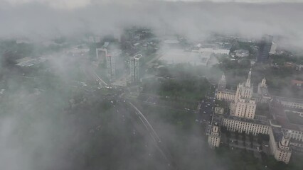 Wall Mural - Bucharest from above. Aerial 4K video during a foggy morning in north part of Bucharest, view to Free Press House (Casa Presei Libere in Romanian) and office skyscraper buildings in Romania.