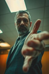 Poster - A man in a suit pointing directly at the camera. Suitable for business concepts