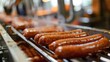 © Natalia - Juicy grilled sausages cooking on a modern industrial grill, with a shallow depth of field.