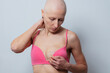 Woman look at surgical scars of mastectomy wear pink underwear