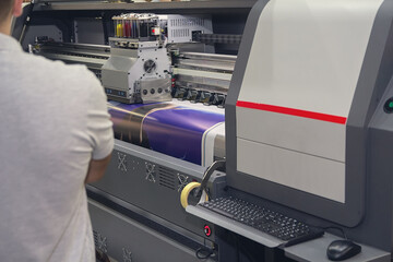 Wall Mural - modern printing machine and worker near it
