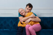 Joyful couple celebrating cancer recession in a loving embrace