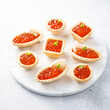 Red caviar served in tartlets