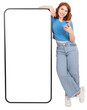 © Designerant - Mobile app offer, happy caucasian red bob hair girl leaning empty blank touch screen huge big mobile phone mock up. Recommending app, advertising, website. Transparent png image.