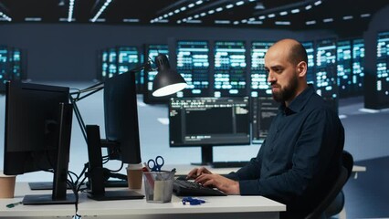 Poster - man programming in high tech facility with server rows providing computing resources for different w