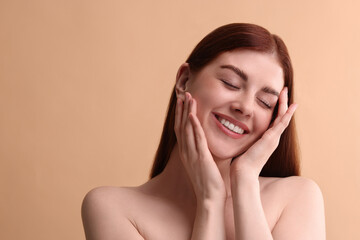 Poster - Portrait of smiling woman on beige background. Space for text