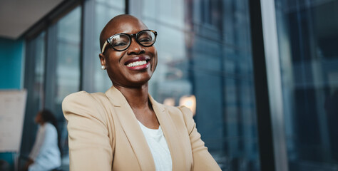 Wall Mural - Female entrepreneur looking at the camera with a smile