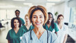 © AI-Universe - Female Doctor und a Diverse team of healthcare professionals smiling in hospital