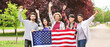 © Pixel-Shot - Group of students with USA flag outdoors