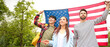 © Pixel-Shot - Group of students with USA flag outdoors