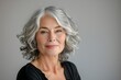 © James - Close-up portrait of a beautiful senior woman smiling, with gray hair isolated on a clean background. Healthy face skin care beauty, skincare cosmetics concept.