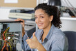 happy female pc technician showing her thumb-up