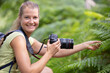 woman taking photo in a field