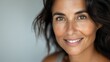 © LoLArt - Gorgeous brunette middle-aged 40th 50th pretty woman with good skin care looking at camera smiling happily aging