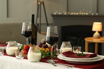 Canvas Print - Stylish table setting with burning candles and wine indoors. Romantic dinner