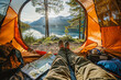 Scenic view from inside a tent overlooking a tranquil lake at sunrise with hiking boots and a map foreground