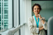 © Drazen - Portrait of confident businesswoman in office looking at camera.