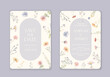 Wedding invitations featuring watercolor wild flowers. The elegant font is set in a rectangular pattern with magenta petals, twigs, and grass accents.