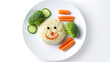 Funny food for children, cute rice with carrots and broccoli on a plate on a white background, a character with a smile and eyes