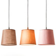 Three lamps hanging from the ceiling, each with a different shade