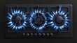 Blue flamed gas stove with black steel grates. Cooktop with lit and off burners. Modern realistic set with propane butane on the hob isolated on transparent background.