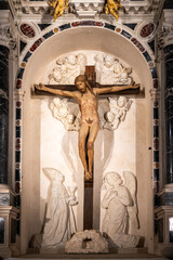 Sticker - Statue of Jesus naked on the cross decorating altar inside catholic church in Italy