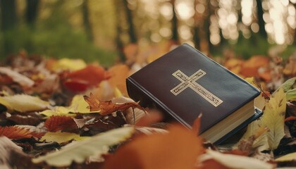 The Bible nestled amond colorful autumn leaves.