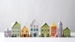cluster of quaint paper houses arranged in a variety of tiny delicate architectures