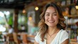 © thekob5123 - The Hispanic female small business owner's smile.
