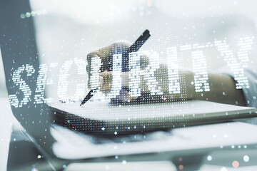 Poster - Cyber security creative concept with hand writing in notepad on background with laptop. Double exposure