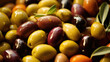 Close up of Mediterranean marinated olives with glossy oil finish, food background