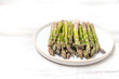 Asparagus on a plate on the table. Healthy menu concept. 