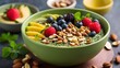A Moringa smoothie bowl, topped with fresh fruits and nuts, the vibrant green color of the Moringa powder adding a pop of color to the already delicious and nutritious meal.