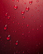 Crimson Hues: A Close-Up of Water Droplets on a Red Surface