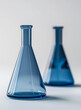 Blue Laboratory Glassware on White Background for Scientific Research