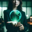 Businesswoman Holding Out Hand with Green Globe Hologram