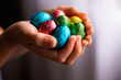 © Austockphoto - cupped hands filled with Easter eggs