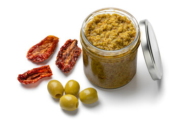 Wall Mural - Glass jar with traditional homemade green olive tapenade close up isolated on white background