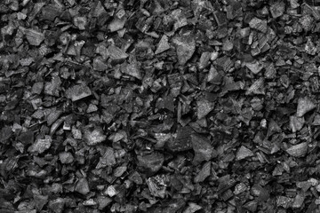 Wall Mural - Black salt flakes close up full frame as background  