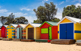 Fototapeta  - Beautiful bathing houses on white sandy beach at Brighton in Melbourne, Australia.