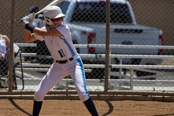 young female fastpitch softball player playing club sports.