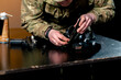 close up in a professional shooting range professional fighter parts cleans pistol introductory briefing