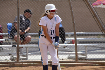 Wall Mural - Young Female fastpitch softball player playing club sports.