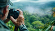 A forest officer holds a black DSLR camera and takes pictures of the smog caused by forest fires, PM2.5.