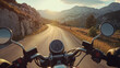 POV riding a motorbike on an empty road in beautiful landscape with mountains on a sunny summer evening