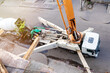 Top-Down Perspective: Concrete Pump Truck Transfers Mixer Truck Load for Floor Pouring at Construction Site.