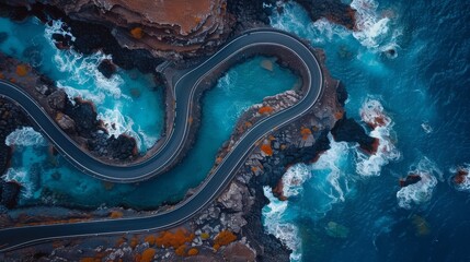 Sticker -   A bird's-eye perspective of a meandering road beside a water body