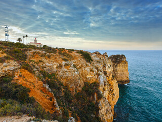 Canvas Print - Evening view of lighthouse on cliff (Ponta da Piedade headland, Lagos, Algarve, Portugal).