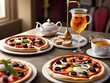 A table topped with three pizzas and two cups of tea.
